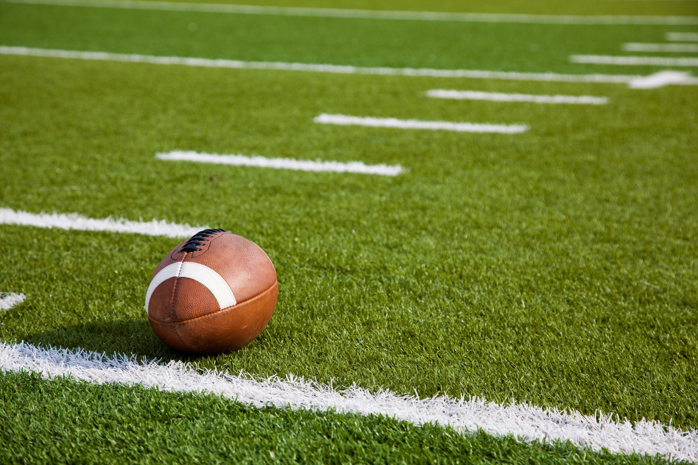 An American football on field